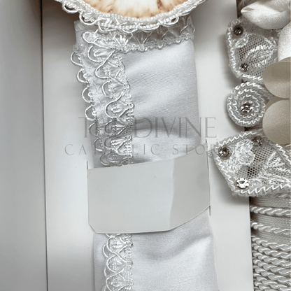 Close up of the 3 piece baptism candle set white fabric towel, embroidered in white nylon thread.