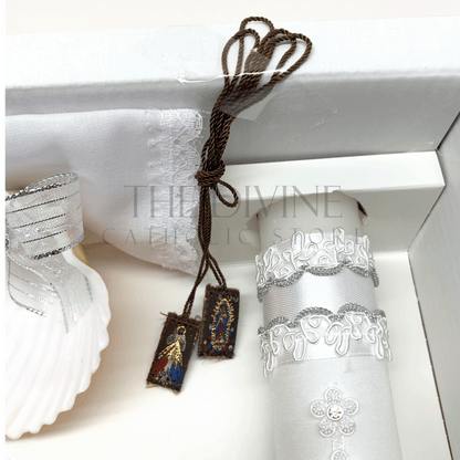 Close up image of the 6 piece baptism candle set scapular showing image of the Divine Mercy image and Our Lady of Guadalupe. 