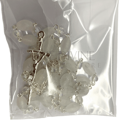 Close up of white crystal beaded rosary with crucifix, in the 6 piece baptism candle set. 