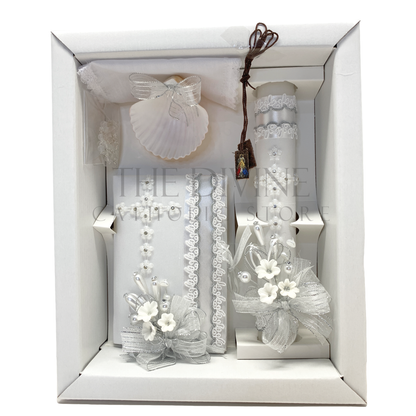 The image features a beautifully designed 6-piece baptism candle set, including a candle, a towel, rosary, bible, scapular, and a shell. The candle is adorned with white fabric, a braided nylon rope design, small white flowers, ribbon and rhinestone embellishments, giving it an elegant and sacred look. 