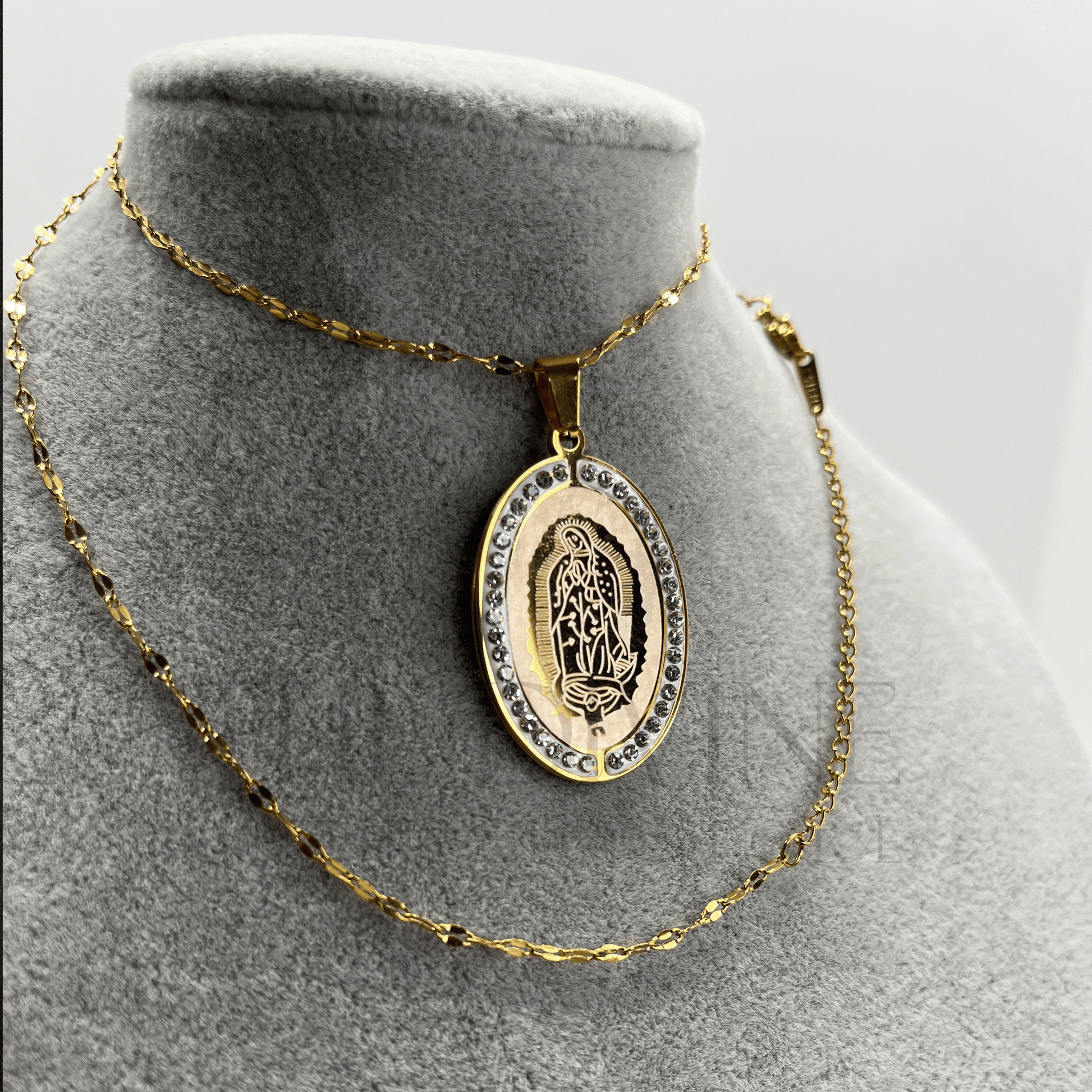 Close-up of Our Lady of Guadalupe Necklace Set with stainless steel pendant and earrings, showcasing intricate details of the Virgin of Guadalupe.