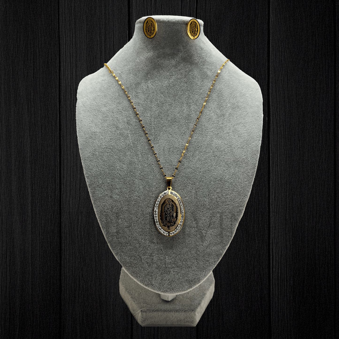 Our Lady of Guadalupe Necklace Set with stainless steel pendant and earrings, featuring a close-up view that highlights the intricate design and details of the Virgin of Guadalupe.